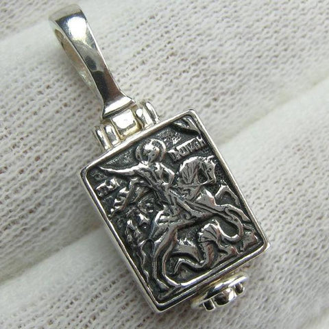 925 Sterling Silver small oxidized icon pendant and locket medallion with Christian prayer inscription to Saint George Victorious depicting the battle with Dragon. Item number MD000781. Picture 1