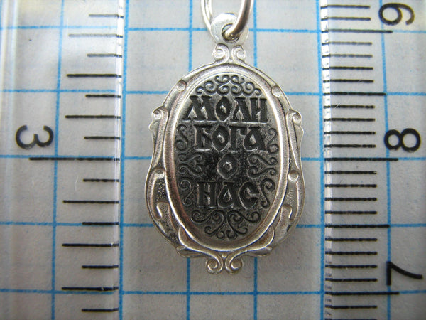 New and never worn solid 925 Sterling Silver small icon pendant and medal with Christian prayer inscription to Saint Martyr Julia holding old believers cross and decorated with filigree frame. Item number MD000730. Picture 11
