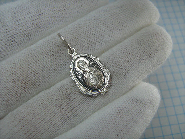 New and never worn solid 925 Sterling Silver small icon pendant and medal with Christian prayer inscription to Saint Martyr Julia holding old believers cross and decorated with filigree frame. Item number MD000730. Picture 2