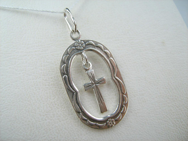 Solid 925 Sterling Silver cross pendant dangling in oval frame. Item number CR001173. Picture 14