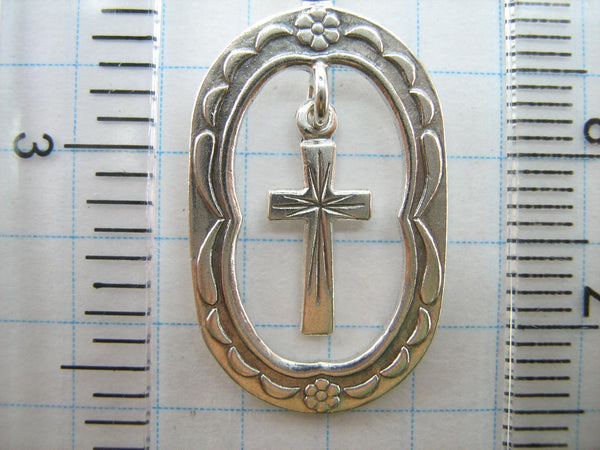 Solid 925 Sterling Silver cross pendant dangling in oval frame. Item number CR001173. Picture 6
