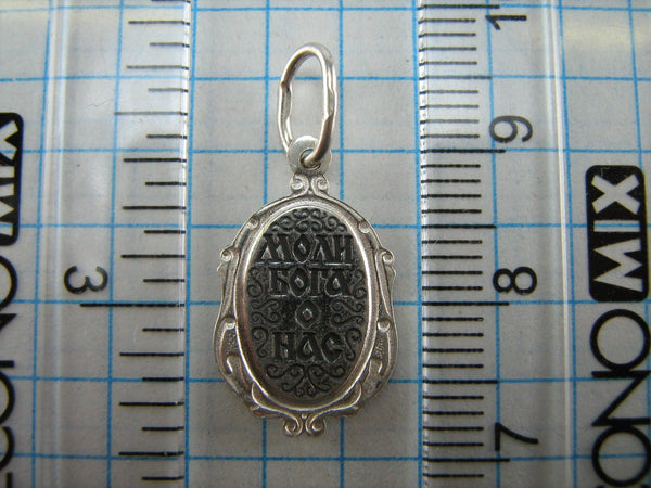 New and never worn solid 925 Sterling Silver small icon pendant and medal with Christian prayer inscription to Saint Martyr Julia holding old believers cross and decorated with filigree frame. Item number MD000730. Picture 9