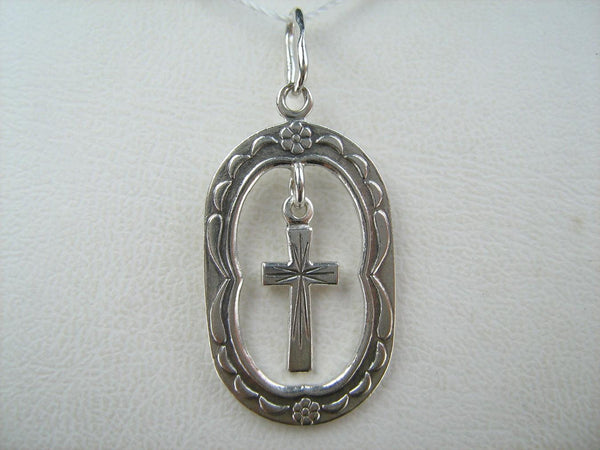 Solid 925 Sterling Silver cross pendant dangling in oval frame. Item number CR001173. Picture 13