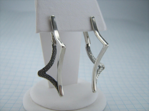 925 solid Sterling Silver long earrings of a rare design with latch back snap closure and oxidized pattern.