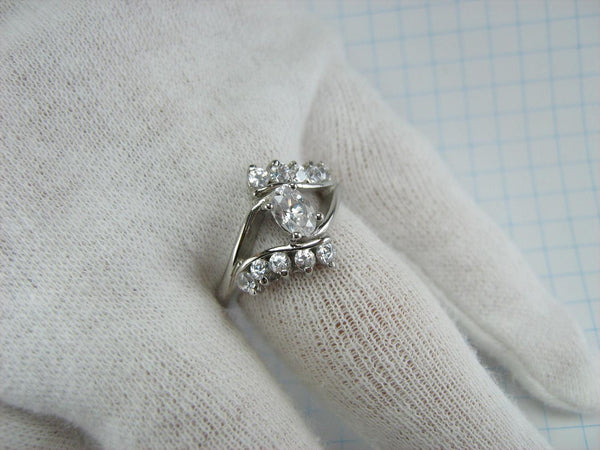Cute 925 solid Sterling Silver ring openwork design decorated with round and oval clear Cubic Zirconia stones.