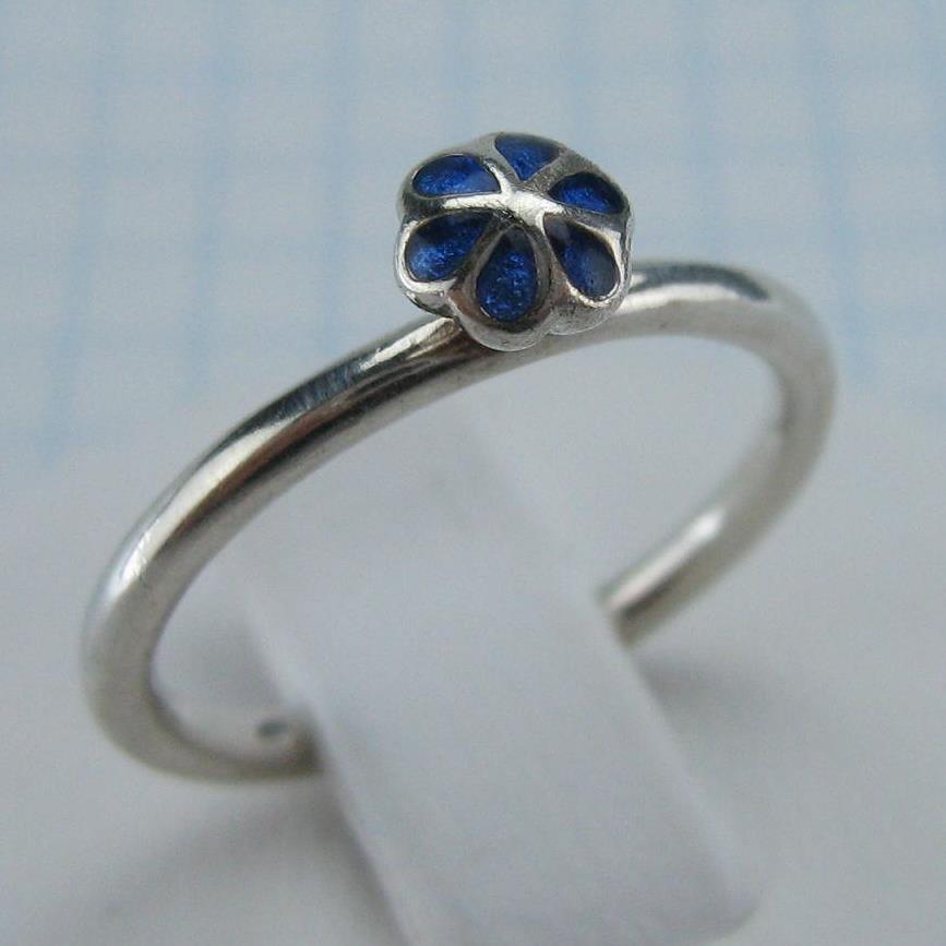 Estate 925 solid Sterling Silver ring with high decorative element depicting flower with blue inlay.