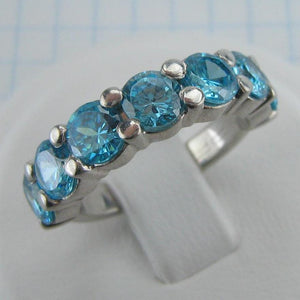 New and never worn 925 solid Sterling Silver cute ring and bright band decorated with 7 large round light blue Cubic Zirconia stones.