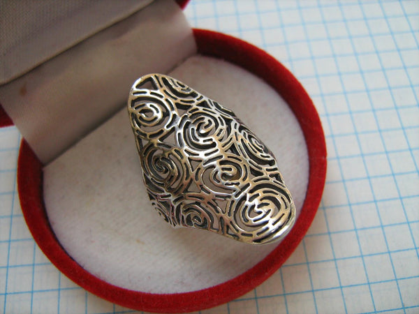 Pre-owned and estate 925 solid Sterling Silver ring with whirlpool or comma or rose flower pattern decorated with openwork oxidized finish