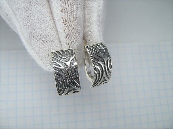 925 solid Sterling Silver earrings with latch back snap closure and oxidized animal stripes pattern.