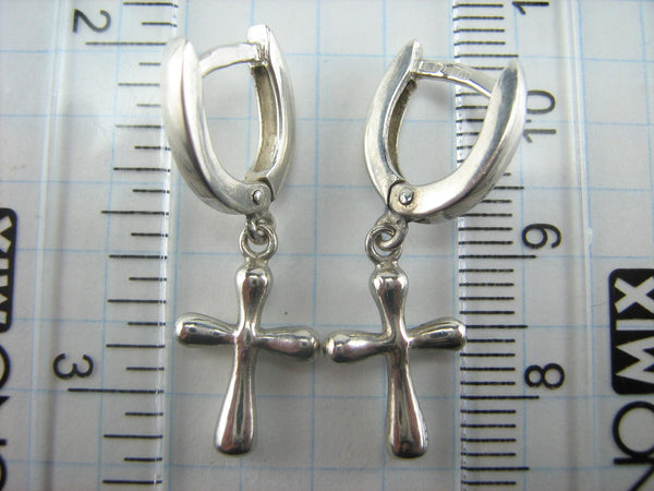 925 solid Sterling Silver earrings with cross pendants and latch back snap closure.