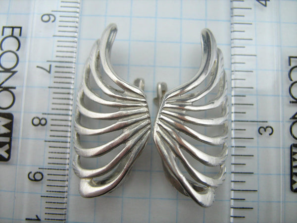 925 Sterling Silver earrings latch back snap closure shaped wings with openwork design.