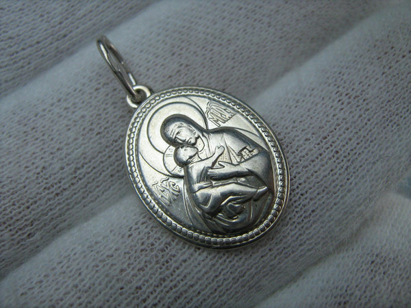Real pure solid 925 Sterling Silver oval icon pendant and medal in frame depicting Mother of God Saint Mary blessed virgin holding Jesus Christ child that stands for Theotokos of Vladimir, also called Tenderness or Eleousa 