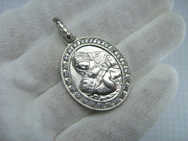 Vintage solid 925 Sterling Silver icon pendant and medal in oval frame depicting Mother of God Nursing Jesus Christ Child.