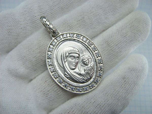 925 Sterling Silver pendant and medal of Kazan icon of Mother of God and Jesus Christ in the frame decorated with colorless stones.