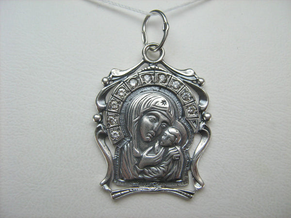 925 Sterling Silver detailed icon pendant and oxidized medal in filigree frame depicting the icon of Mother Mary of Vladimir and Jesus Christ. This Christian jewelry is decorated with Cubic Zirconia stones and manual oxidized work.