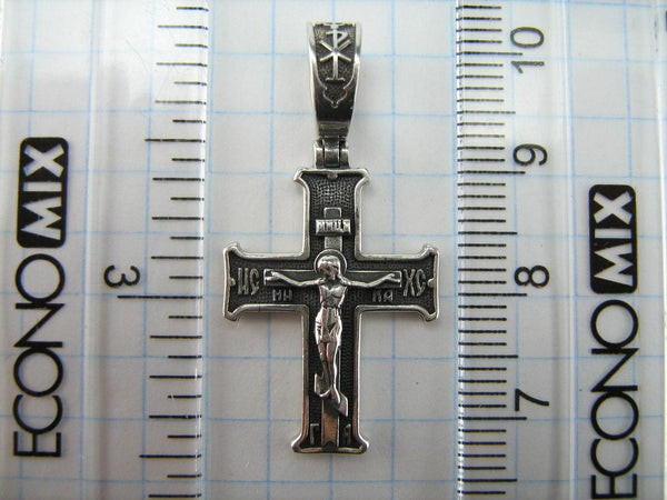 Vintage solid 925 Sterling Silver oxidized cross pendant and crucifix with Christian prayer inscription to Jesus Christ decorated with filigree pattern, depicting a Chi Rho symbol, also called chrismon or christogram.