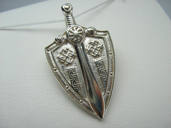 925 Sterling Silver large pendant shaped shield and sword decorated with Celtic knots and swastika pattern.