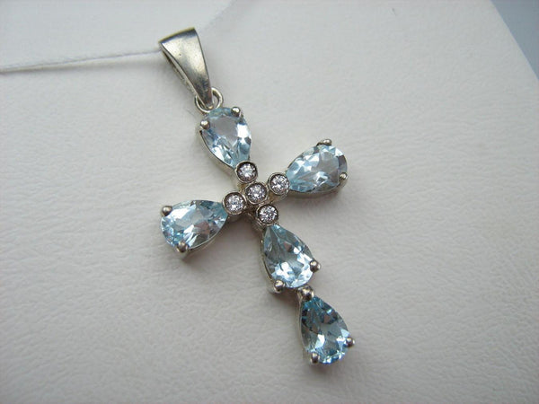 New solid 925 Sterling Silver cross pendant decorated with sky blue topaz gemstones.