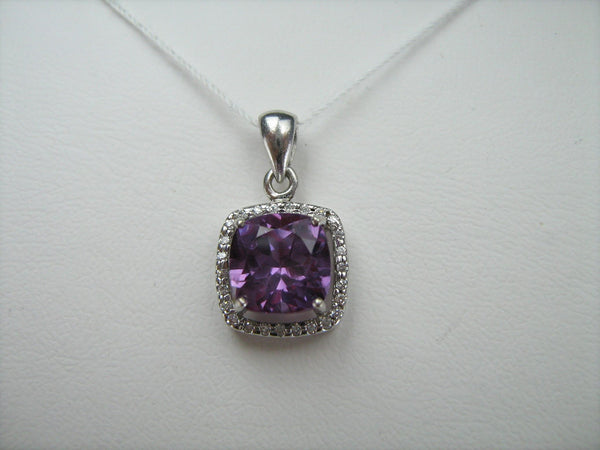 925 Sterling Silver small pendant with purple and red color change stone shaped surrounded by white Cubic Zirconia stones.