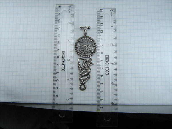 925 Sterling Silver dangling pendant decorated with openwork oxidized dragon under the shield.