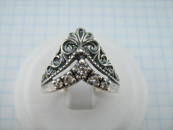 Pre-owned and estate 925 solid Sterling Silver ring shaped crown with openwork filigree pattern and five round clear Cubic Zirconia stones.