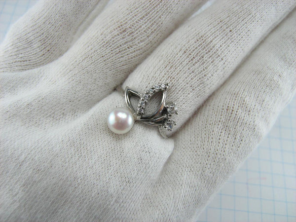 925 solid Sterling Silver ring with pinkish white freshwater pearl and plant openwork pattern.