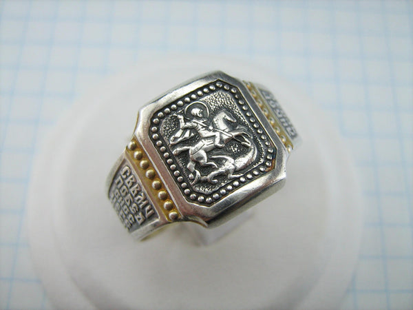 925 Sterling Silver and gold plated signet and wide band with Christian prayer inscription to Saint George and depicting the warrior fighting a dragon on the oxidized background with blessing prayer text.