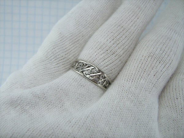 Lovely 925 solid Sterling Silver ring with openwork filigree pattern decorated with round clear Cubic Zirconia stones.