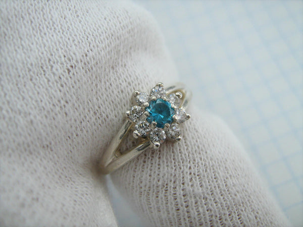 Pre-owned and estate 925 solid Sterling Silver cluster ring shaped flower or star and decorated with round white and blue Cubic Zirconia stone
