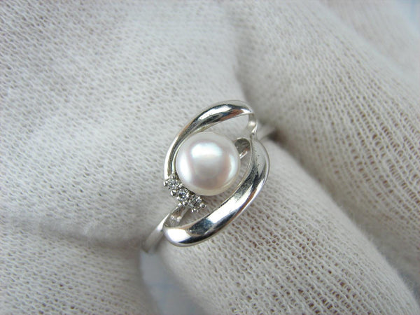 925 solid Sterling Silver ring with pinkish white freshwater pearl and openwork decoration.