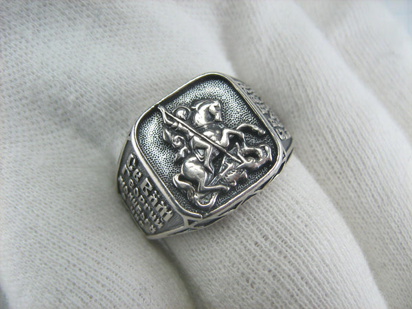 925 Sterling Silver heavy signet with Christian prayer inscription to Saint George depicting the warrior fighting a dragon on the oxidized background with blessing prayer text.