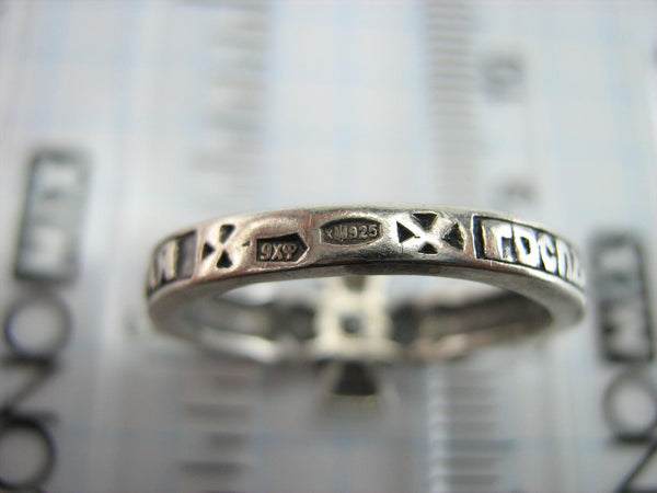 Solid 925 Sterling Silver ring shaped cross with Christian prayer inscription to God on the oxidized background.