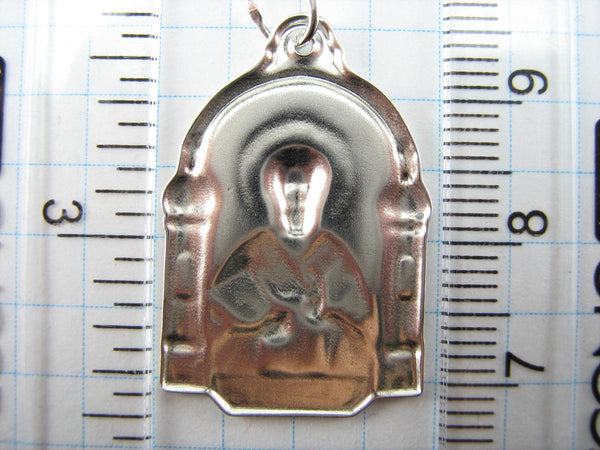 Vintage solid 925 Sterling Silver icon pendant and medal depicting Saint Nicholas the Wonderworker surrounded by church buildings with dome.