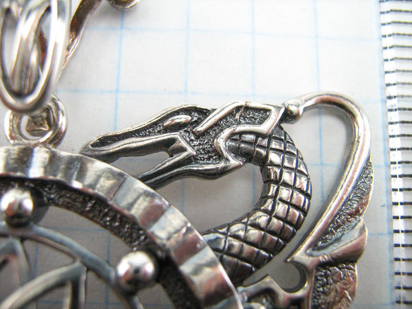 925 Sterling Silver pendant decorated with openwork oxidized dragons around the shield.