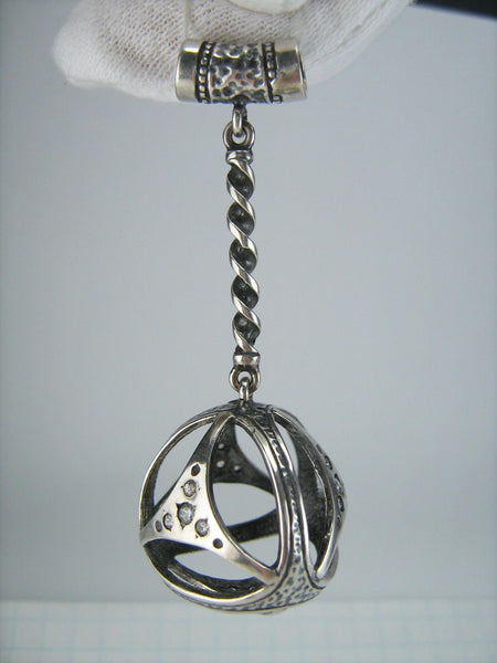 925 Sterling Silver oxidized dangling pendant decorated with openwork oxidized detailed finish and Cubic Zirconia stones.