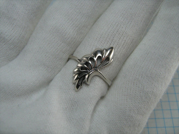Pre-owned and estate 925 solid Sterling Silver ring depicting a long leaf or a fan decorated with handicraft oxidized openwork finish