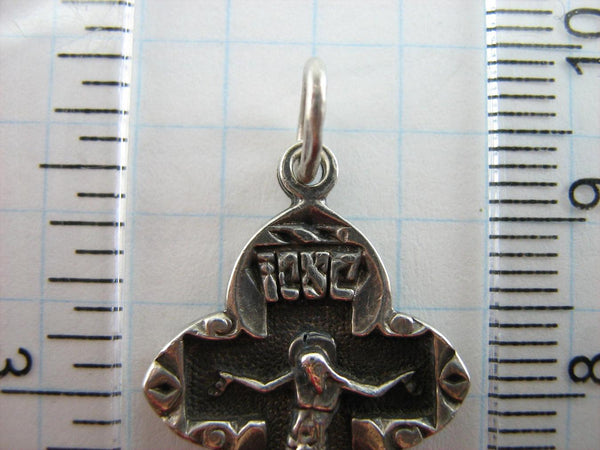 Vintage solid 875 Sterling cross pendant and crucifix with Christian prayer decorated with plant, floral and filigree pattern, depicting a Chi Rho symbol, also called chrismon or christogram.