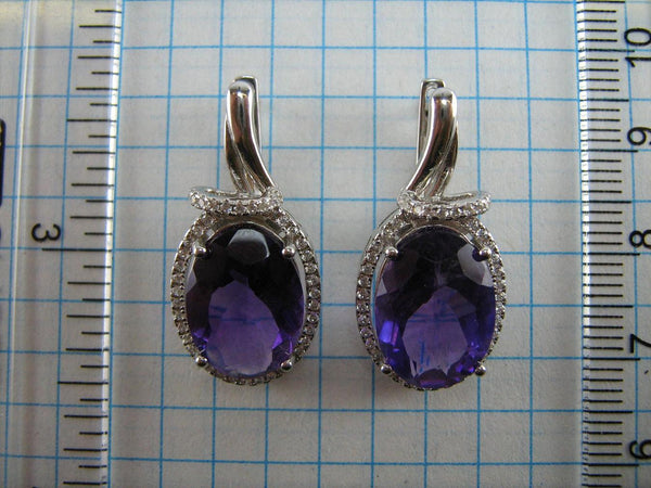 925 solid Sterling Silver earrings with genuine purple amethyst and latch back snap closure.