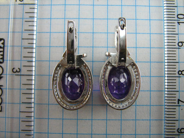 925 solid Sterling Silver earrings with genuine purple amethyst and latch back snap closure.