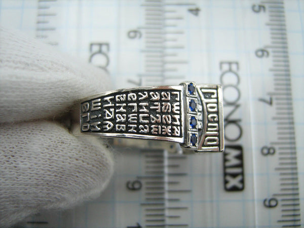 925 Sterling Silver signet with Christian prayer inscriptions on the oxidized background with grapevine cross and decorated with eight CZ blue stones.