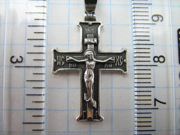 Vintage solid 925 Sterling Silver oxidized cross pendant and crucifix with Christian prayer inscription to Jesus Christ decorated with filigree pattern, depicting a Chi Rho symbol, also called chrismon or christogram.
