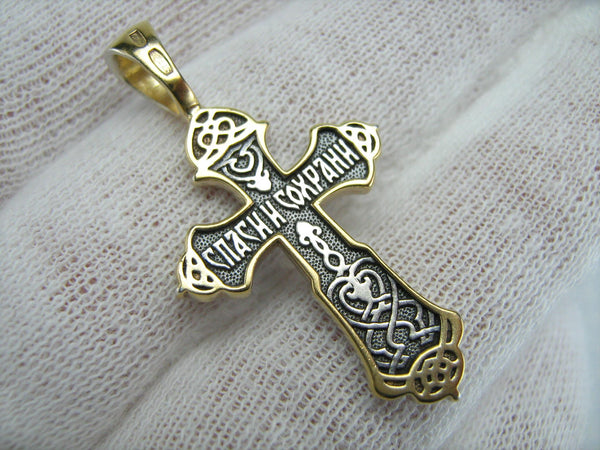 Vintage solid 925 Sterling Silver and Gold plated oxidized cross pendant and crucifix with Christian prayer inscription to Jesus Christ decorated with plant, floral and filigree pattern, depicting a Chi Rho symbol, also called chrismon or christogram.