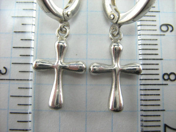 925 solid Sterling Silver earrings with cross pendants and latch back snap closure.