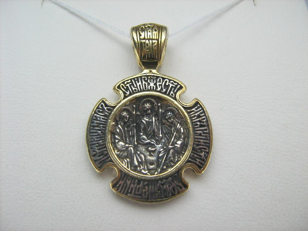 925 Sterling Silver icon pendant and cross medal with Christian prayer inscription depicting icons of Holy Trinity and Theotocos of the Sign.925 Sterling Silver icon pendant and cross medal with Christian prayer inscription depicting icons of Holy Trinity and Theotocos of the Sign.