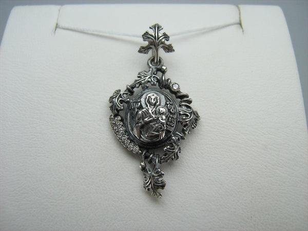 925 Sterling Silver icon pendant and medal depicting Mother of God Mary and Jesus Christ child in a lovely grapevine frame.
