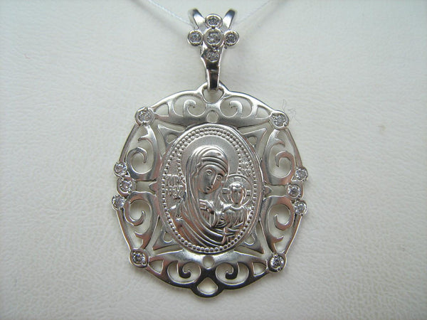 925 Sterling Silver pendant and medal of Kazan icon of Mother of God and Jesus Christ in the openwork frame decorated with stones.