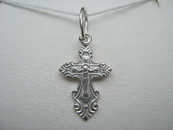Cute and lovely solid 925 Sterling Silver tiny cross pendant for kids and children with Jesus Christ crucifix, Christian prayer inscription to God decorated with filigree and fleur de lis pattern.