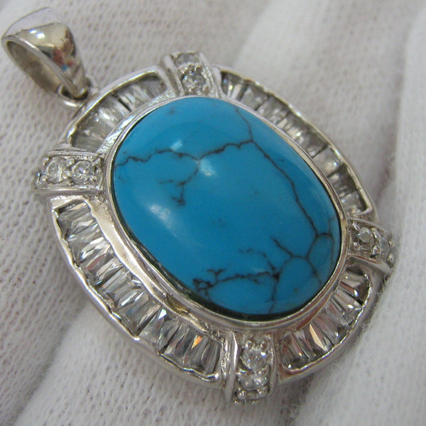Vintage solid 925 Sterling Silver pendant with bright blue cabochon stone with black veins looking like a turquoise gem decorated with Cubic Zirconia 