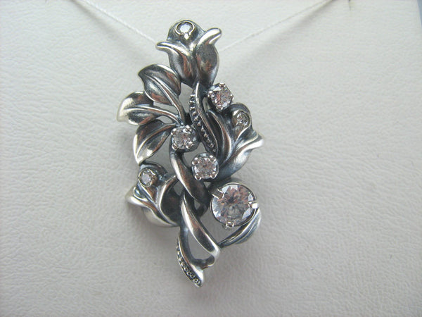 925 Sterling Silver pendant shaped bouquet of roses with white Cubic Zirconia stones.