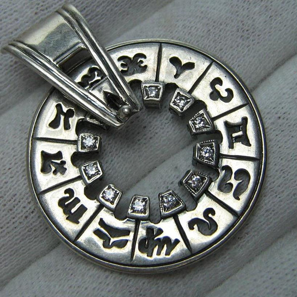 Vintage solid 925 Sterling Silver oxidized spinning pendant depicting the year calendar decorated with openwork symbols of zodiac signs detailed finish and Cubic Zirconia stones